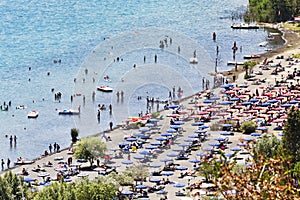 Tourists enjoy sun and watersports in the volcano lake of Castel Gandolfo