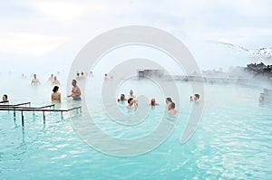 Tourists enjoy taking a bath at Blue Lagoon, Iceland