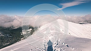 Tourists enjoying high mountains in snow on a sunny day - vintage film look