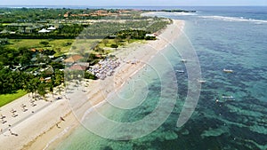 Tourists enjoying a holiday at Nusa Dua beach