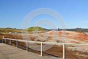 Tourists enjoying nice view on Gunnuhver geothermal area close to Grindavik