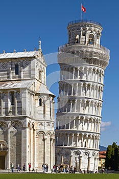 Tourists Enjoying Sunny Day In Front Of the Leaning Tower of Pisa in Tuscany Italy