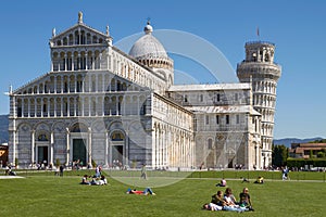 Tourists Enjoying Sunny Day in Front Of the Leaning Tower of Pisa in Tuscany Italy