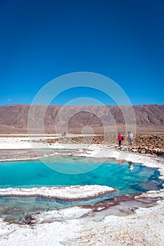 Tourists enjoying a sunny day at Lagunas Escondidas, Atacama Desert