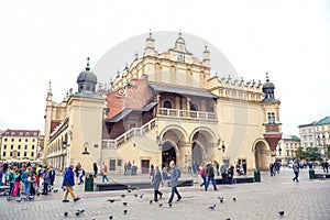 Tourists at Krakow Cloth Hall located in center of town square in the Krakow, Poland