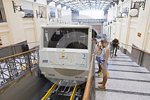 Tourists entering the funicular at Atan Stazione Funicolare Centrale