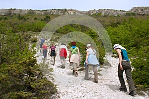 Tourists on excursion in mountains