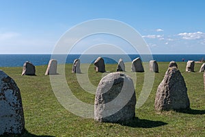 Tourists explore Gettlinge grave field with its famous stone ship in Gettlinge. The oldest graves date back to the Nordic bronze