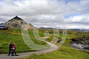 Tourists exploring the Icelandic volcanic landscape