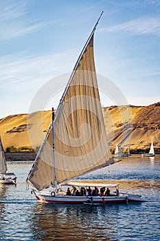 Tourists in a Felucca boat on the Nile River in Luxor Thebes