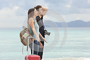 Tourists frustrated with the bad weather on the beach