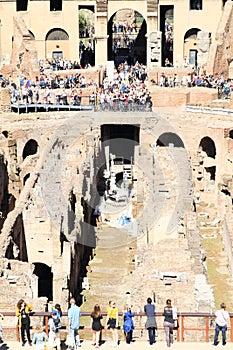 Tourists on gallery of Colosseum with workers