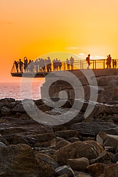 Tourists at The Gap at sunset