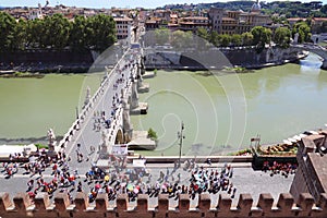 Tourists going on Sant' Angelo Bridge at summer