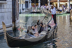 Tourists in a gondola, Venice, Italy