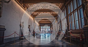 Tourists in hallway of the Uffizi Gallery in Florence