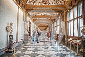 Tourists in hallway of the Uffizi Gallery in Florence