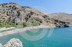 Tourists have a rest on the Preveli Beach