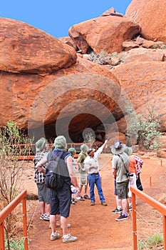 Tourists hike in the Olgas mountains,NT, Australia