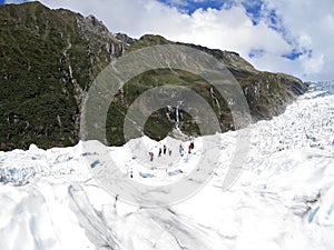 Tourists hiking on Fox Glacier, New Zealand