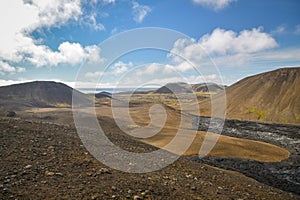 Tourists hiking next to lava field from Geldingadalir volcano