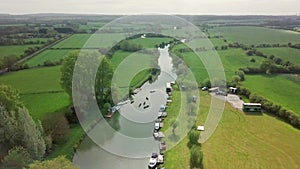 Tourists Kayaking With Boats Moored On The River Thames In Abingdon Town Near Oxford City, UK, Surr