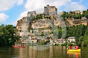 Tourists kayaking on river Dordogne in France photo