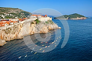 Tourists, kayaking, view at The Old town of Dubrovnik and Lokrum island from Fort Lovrijenac, Croatia