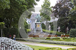 Tourists and local people relaxing in Square of Petit Sablon park photo