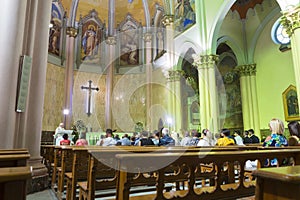 Tourists and local people at the Sunday mass in Church of the Holy Redeemer