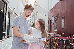 Tourists looking at the map on the street in Europe