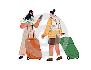 Tourists with luggage, phone. Women passengers standing with suitcases, backpack, travel bags. Happy girls with baggage