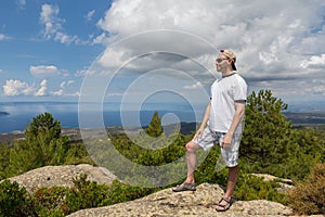 Tourists men on Aegean coast of Sithonia peninsula