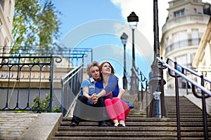 Tourists on Montmartre sitting at the stairs