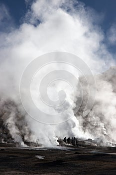 Tourists near erupting geyser, Chile