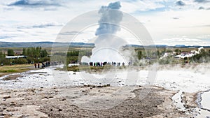 tourists near Strokkur geyser in Haukadalur