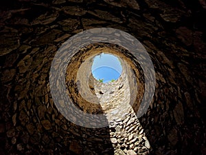 tourists at the old castle fell into the famine. the view from the well up to