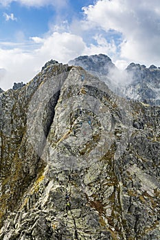 Tourists on one of the most difficult trails in the Tatras in Poland - Orla Perc Eagle`s Path.