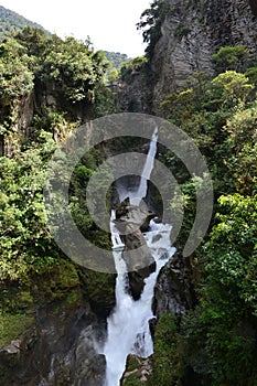 Tourists at the Pailon del Diablo waterfall in BaÃÂ±os, Ecuador photo