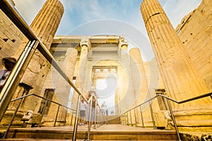 Tourists pass through the Propylaea entrance to the Parthenon, motion blur