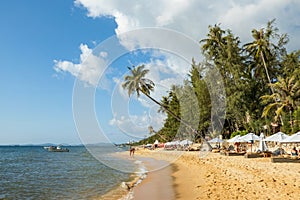 Tourists on the Phu Quoc beach on a sunny day