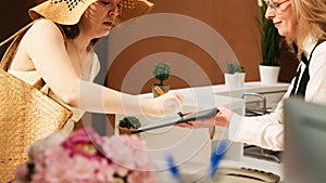 Tourists registering at front desk