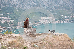 Tourists relax on ruins of fortress of St. John Illyrian Fort