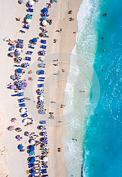 Tourists relaxing on the Egremni Beach in Lefkada swimming and p