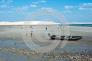 Tourists rest on the the beach of Jericoacoara