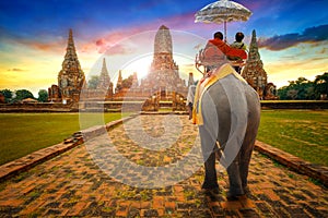 Tourists Ride an Elephant at Wat Chaiwatthanaram temple in Ayuthaya, Thailand