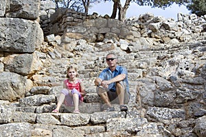 Tourists in the ruins of the ancient city of Lato photo