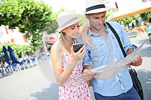 Tourists searching the way in the city