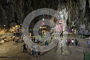 Tourists seen exploring and praying in the Hindu Temple, Batu Caves, Malaysia.