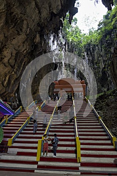 Tourists seen exploring and praying in the Hindu Temple, Batu Caves, Malaysia.